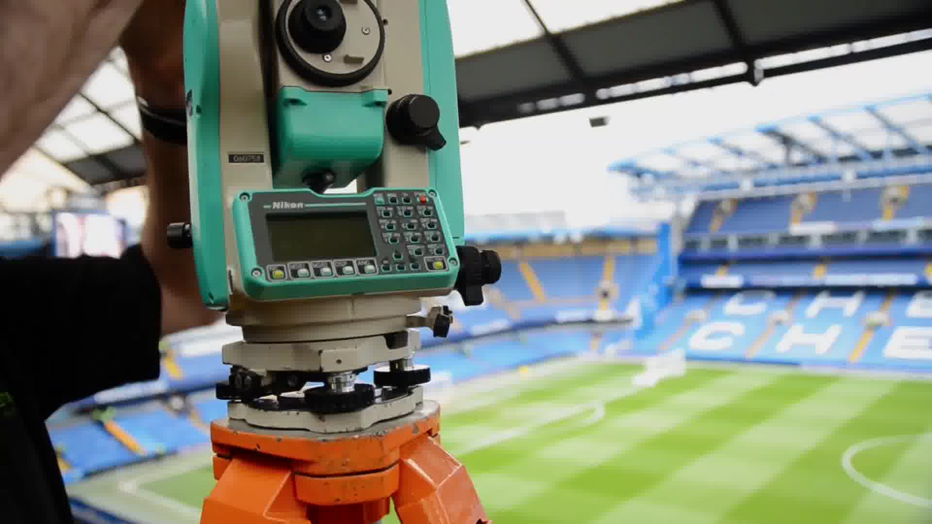 Laser theodolite measuring Chelsea Stadium in London